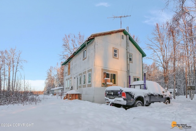 view of snow covered property