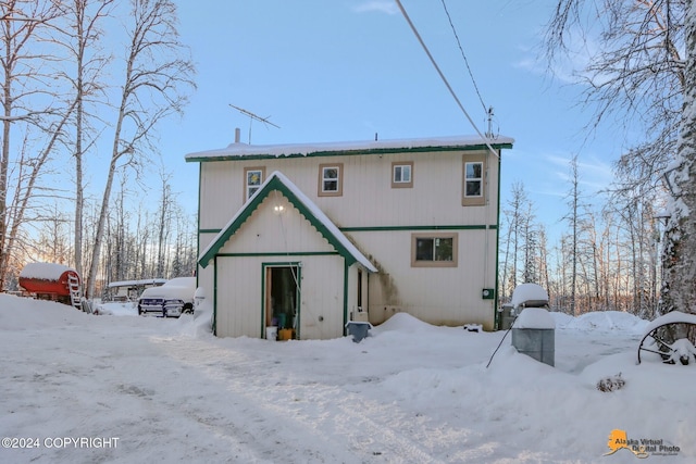 view of snow covered house