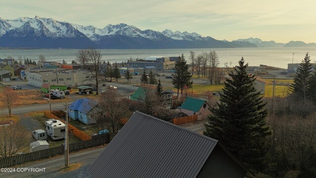 exterior space with a water and mountain view