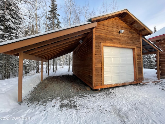 view of snow covered garage