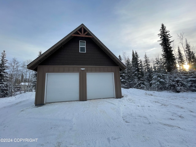 view of snow covered garage