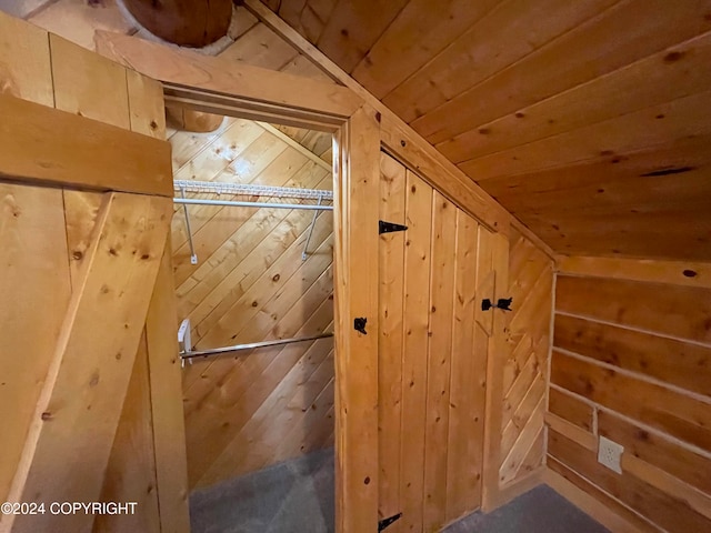 bonus room featuring wood walls, wood ceiling, and lofted ceiling