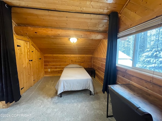 bedroom with wooden walls, carpet floors, wood ceiling, and vaulted ceiling