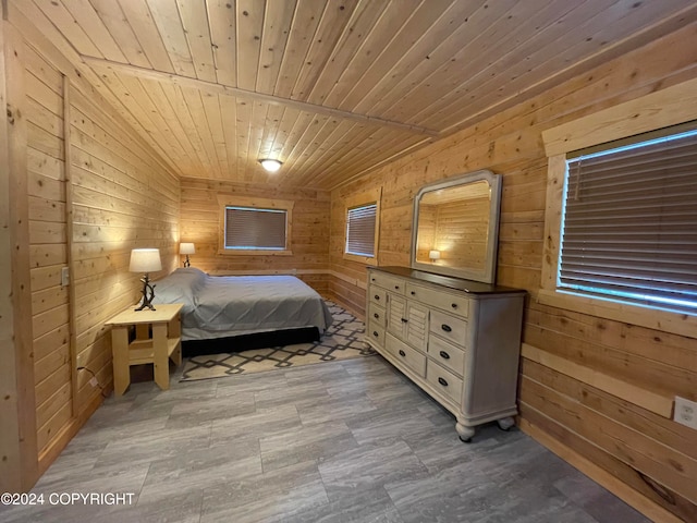 bedroom with wood walls and wood ceiling