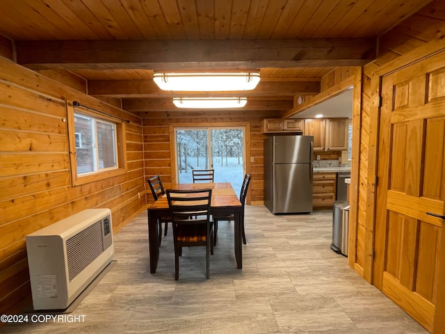 dining room featuring beamed ceiling, wood ceiling, wooden walls, and heating unit