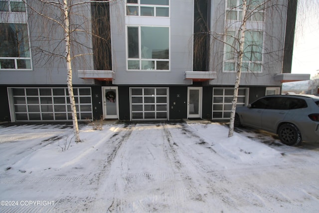 view of snow covered property entrance