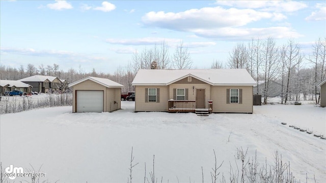 single story home with a garage and an outbuilding