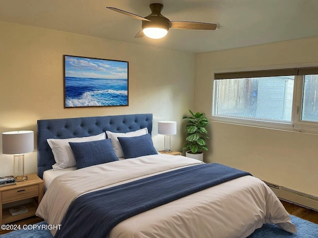 bedroom with dark hardwood / wood-style flooring, a baseboard radiator, and ceiling fan