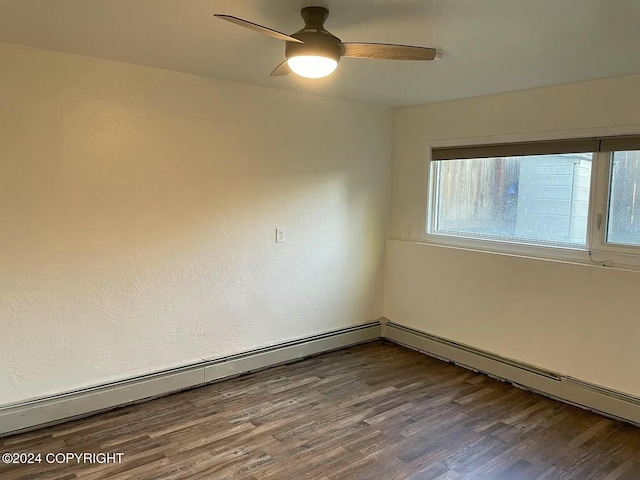 empty room featuring wood-type flooring, baseboard heating, and ceiling fan