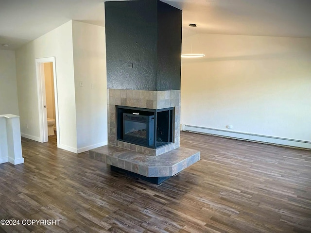 unfurnished living room with a fireplace, vaulted ceiling, dark wood-type flooring, and a baseboard radiator