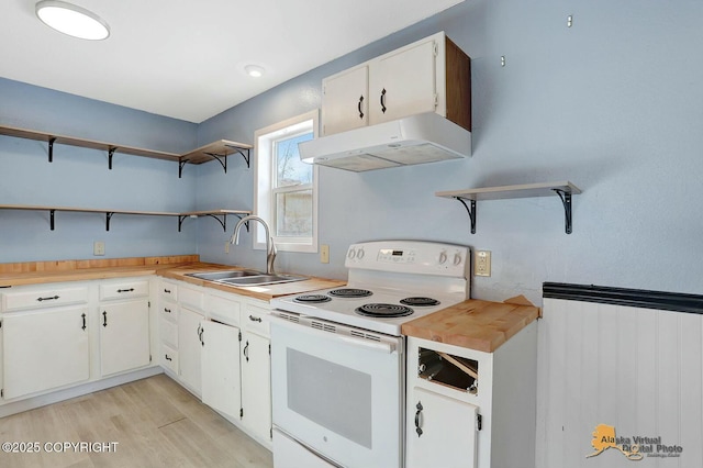 kitchen featuring open shelves, under cabinet range hood, light wood-type flooring, white electric range, and a sink