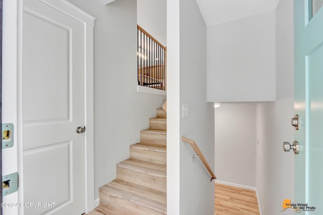 stairway featuring hardwood / wood-style flooring