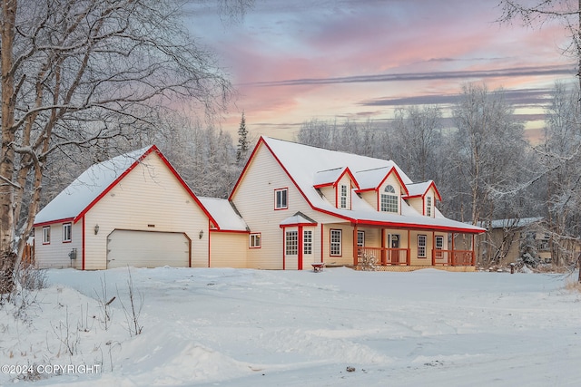 view of front of house with covered porch and a garage