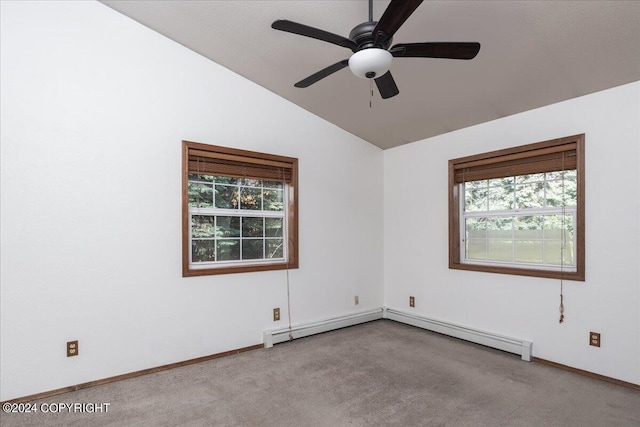 spare room featuring ceiling fan, a healthy amount of sunlight, vaulted ceiling, and light carpet