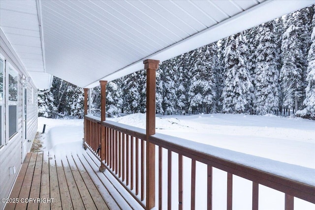 view of snow covered deck