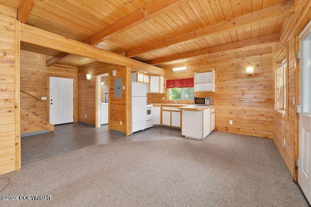 kitchen featuring white appliances, wood ceiling, and wood walls