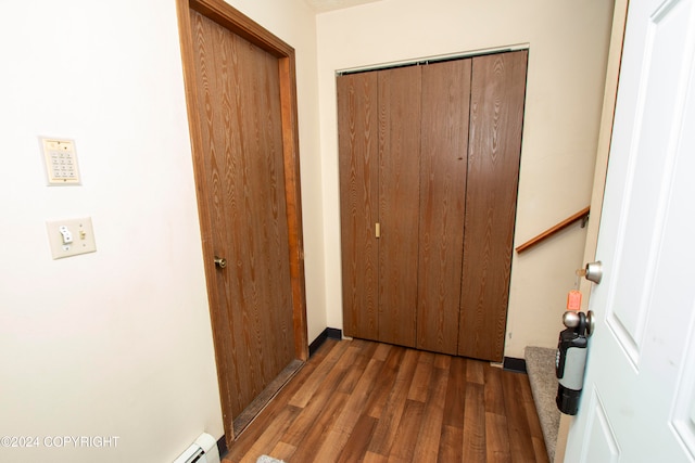 hallway with dark hardwood / wood-style flooring