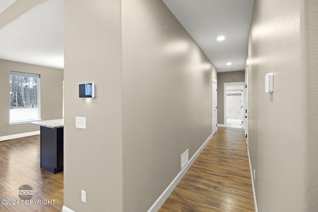 corridor with dark wood-type flooring