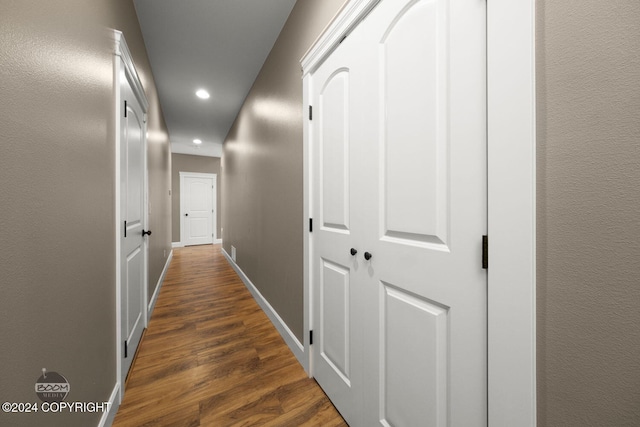 corridor featuring dark hardwood / wood-style floors