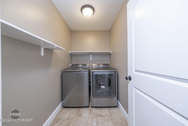 washroom featuring washing machine and dryer