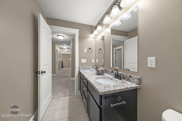 bathroom with tile patterned floors and vanity