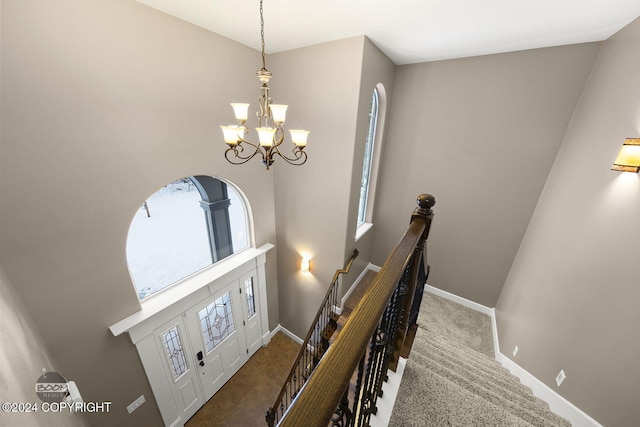 foyer with a chandelier and a wealth of natural light