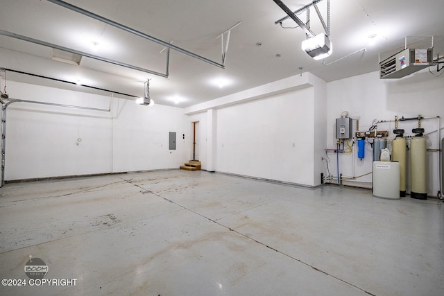 garage featuring electric panel and a garage door opener