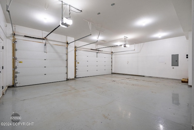 garage featuring electric panel and a garage door opener