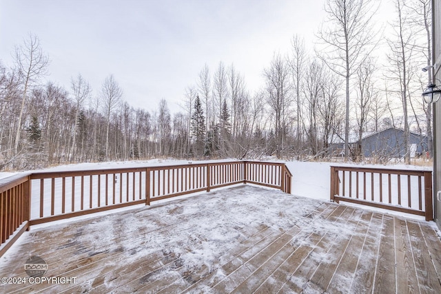 view of snow covered deck