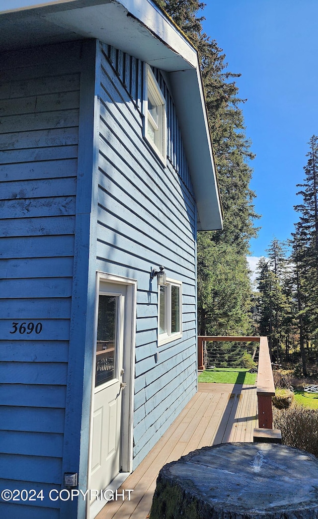 view of side of property featuring a deck