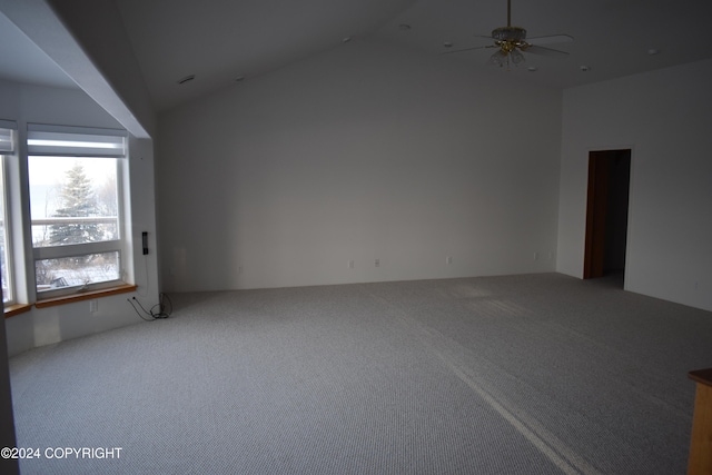 unfurnished room featuring carpet, ceiling fan, and lofted ceiling