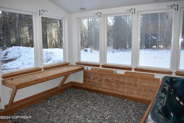 sunroom featuring lofted ceiling