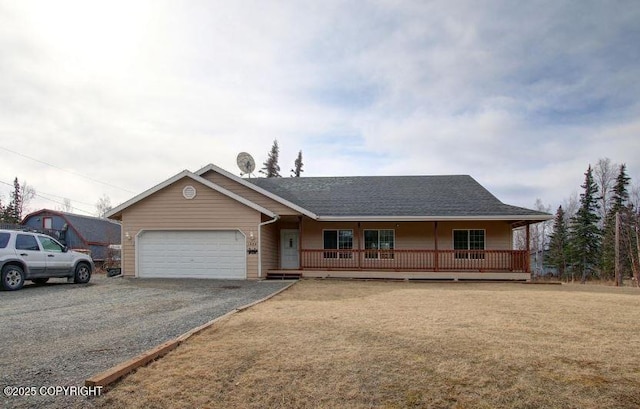 1985 E Caribou Loop, Wasilla, AK 99654 - ranch-style home featuring a porch, a garage, driveway, and a shingled roof