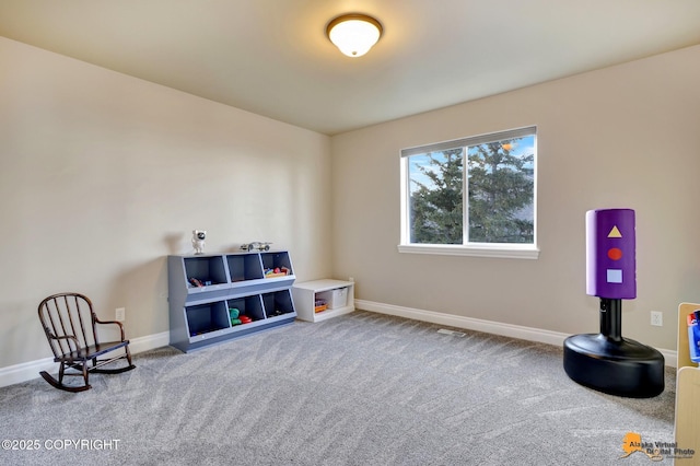 interior space with carpet and baseboards