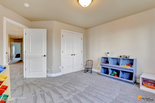 playroom featuring carpet flooring and baseboards