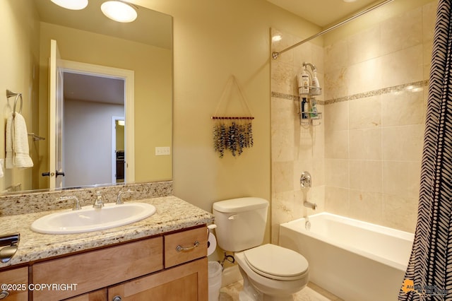 full bathroom featuring shower / tub combo, vanity, and toilet