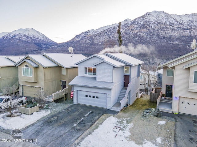 view of front of home featuring a mountain view and a garage