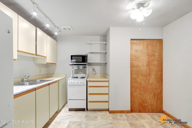 kitchen with sink and white range