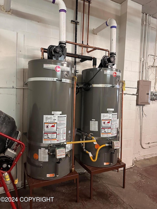 utility room featuring secured water heater