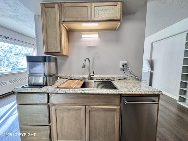 kitchen featuring a sink, light stone counters, a textured ceiling, baseboards, and dark wood-style flooring