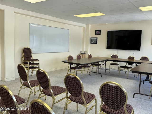 office area featuring a paneled ceiling and baseboards