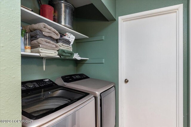 washroom featuring independent washer and dryer