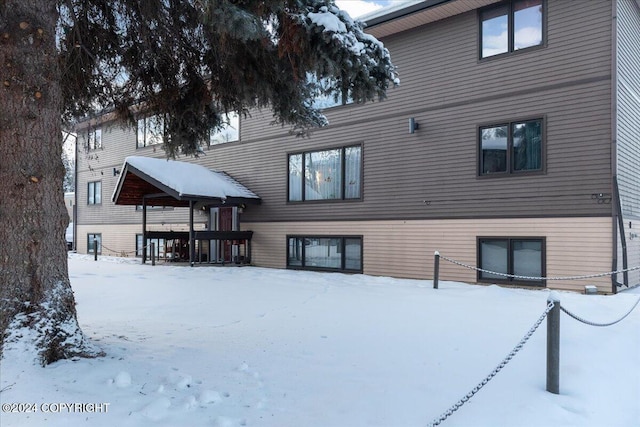 view of snow covered house