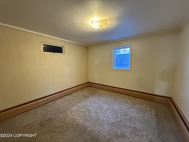 unfurnished room featuring carpet flooring and crown molding