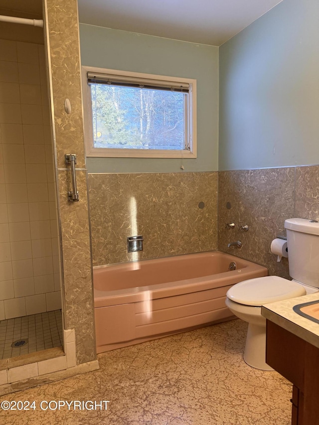 full bathroom with shower with separate bathtub, toilet, and tile walls