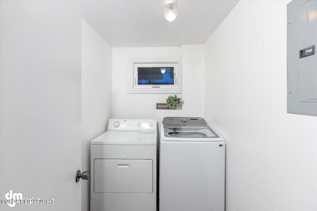 washroom with separate washer and dryer and electric panel