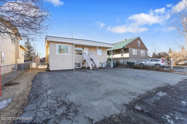 view of front of home with fence