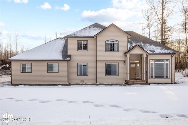 view of snow covered house