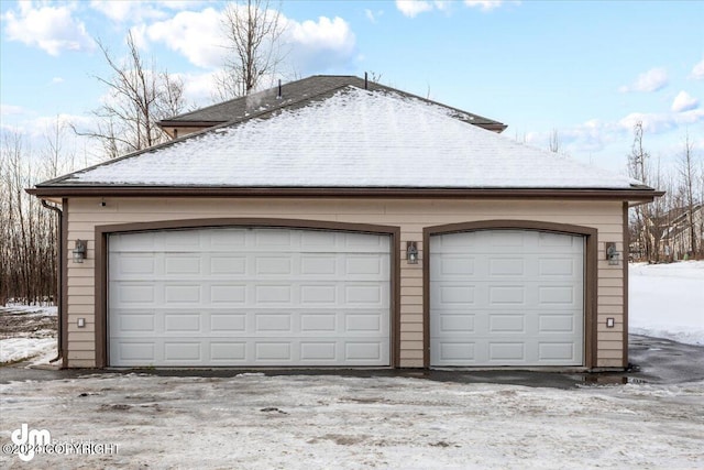 view of snow covered garage