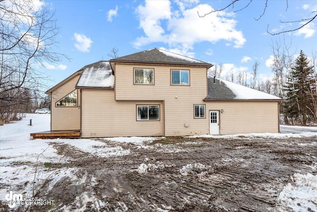 view of snow covered house